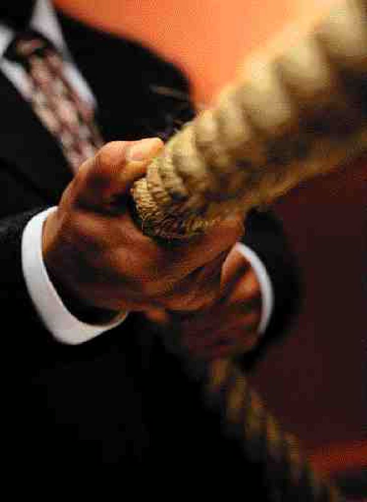 SIZING UP IN: a TUG of WAR Image