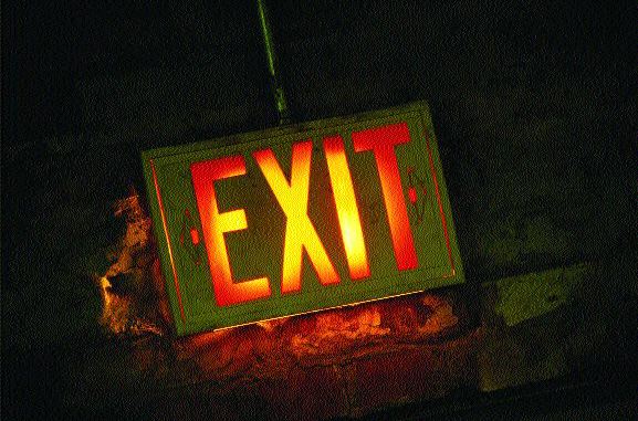 Brokers Facing Exit Signs Image