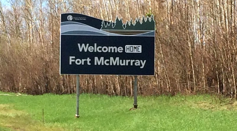 Returning Fort McMurray residents finding smelly refrigerators, dandelion lawns Image