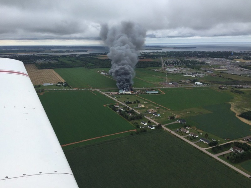 Massive fire destroys farm equipment dealership, forces evacuation in P.E.I. Image