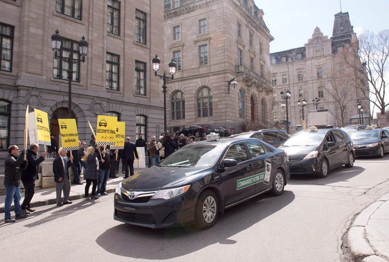 Quebec taxi lobby furious with Uber deal; considering legal action, protests Image