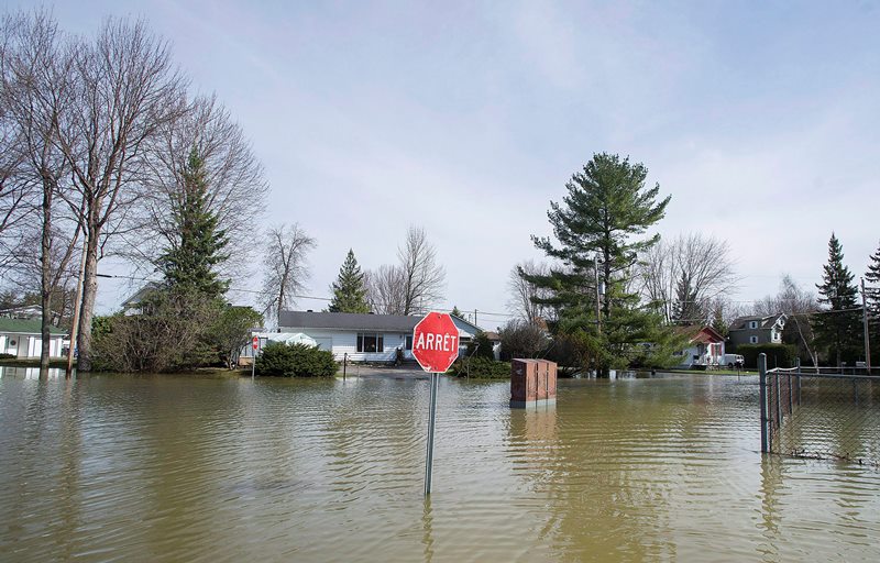 Public security minister preaches patience as Quebec towns deal with flooding Image