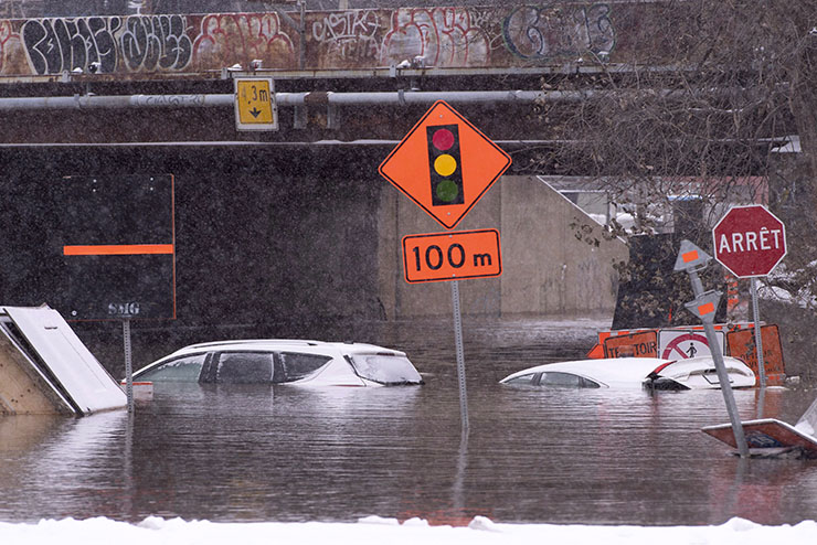 Cars submerged in flooded Montreal tunnel Image