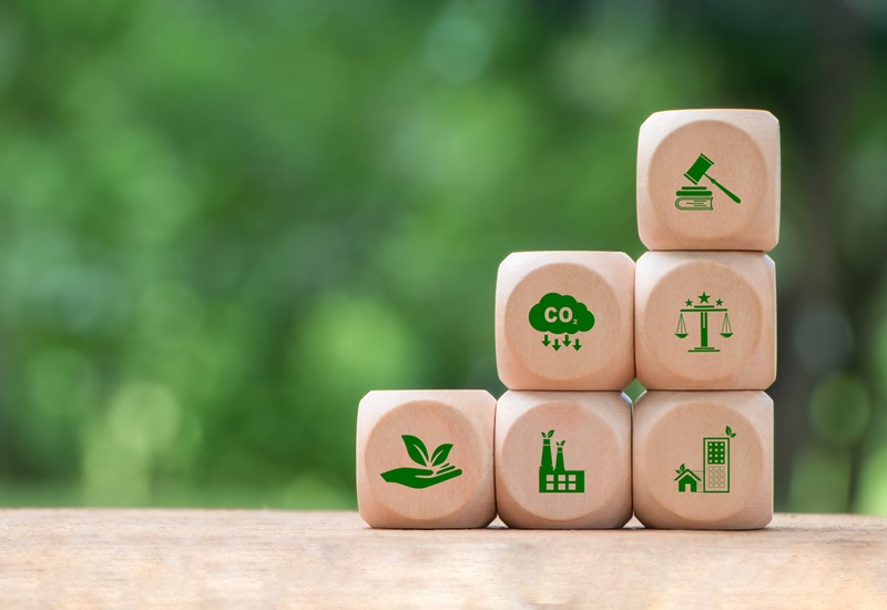 Wooden block with environmental law icons. Concept of international law environmental protection, environmental impact assessment, Eco friendly law, eco balance, business corporate and industry.