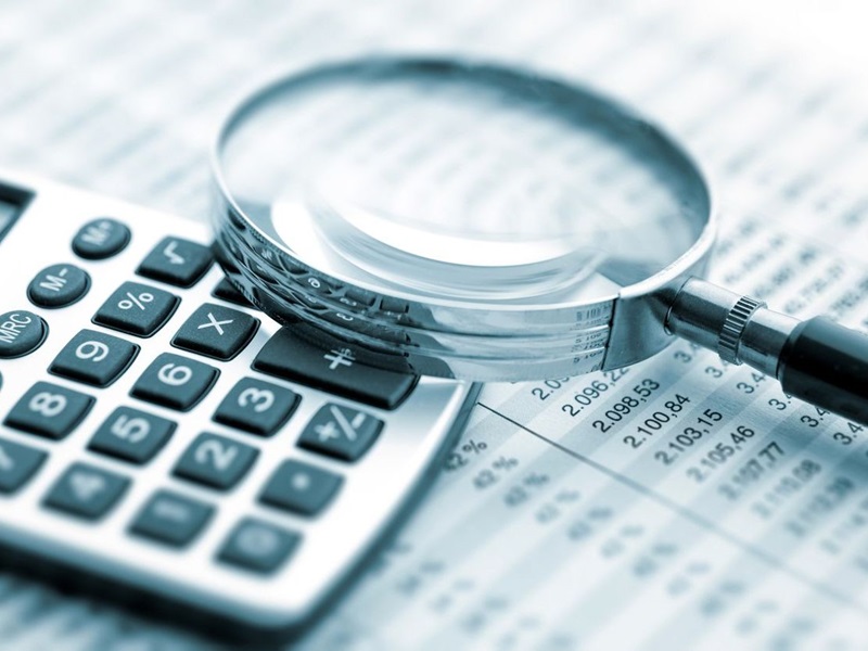 Magnifying glass on financial chart