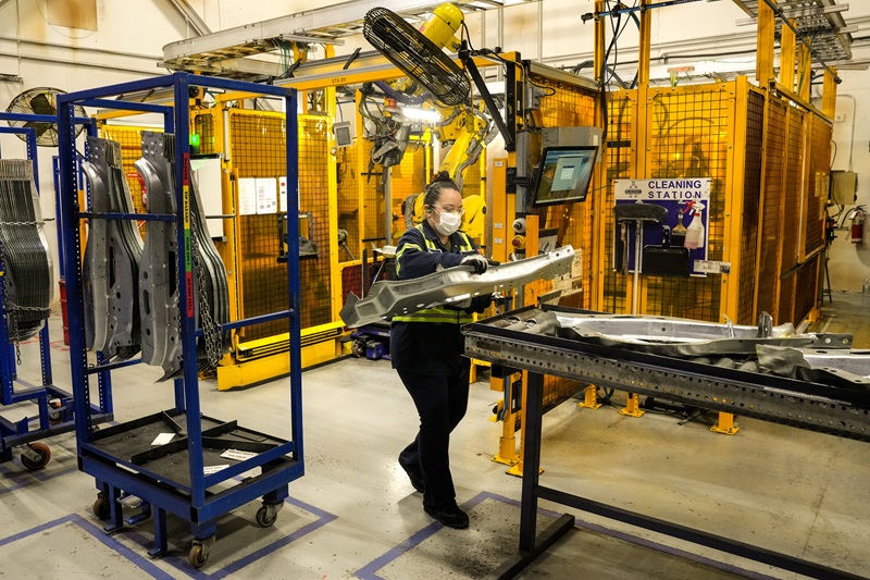An employee works on the production line at the Martinrea auto manufacturing plant