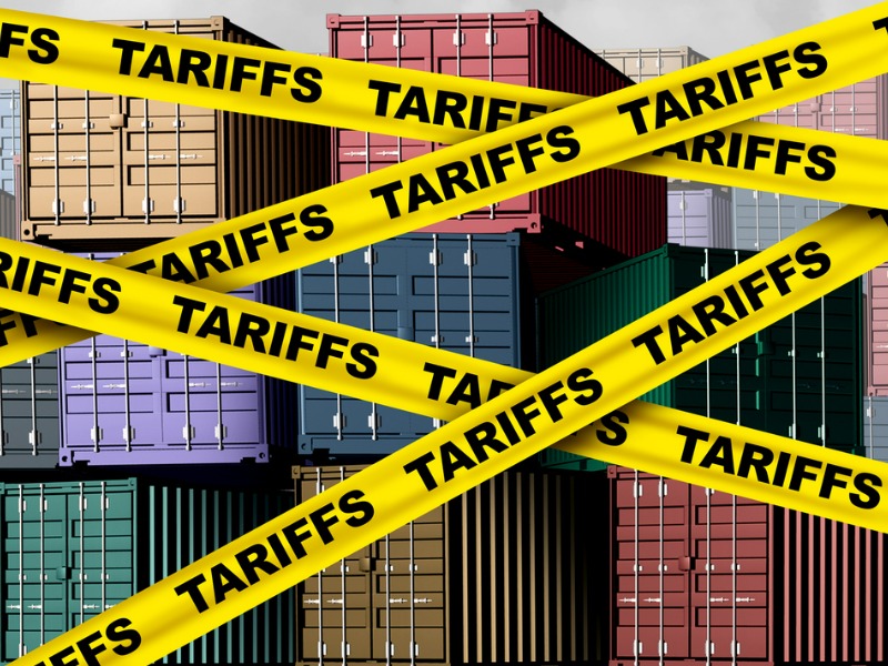 Shipping containers surrounded by Tariff Tape