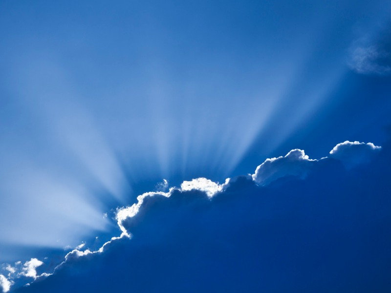 Silver lining streaming through clouds