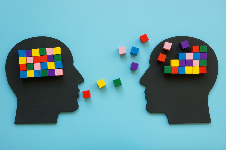 Heads with colorful cubes as symbol of mentoring and psychotherapy. alternate text for this image