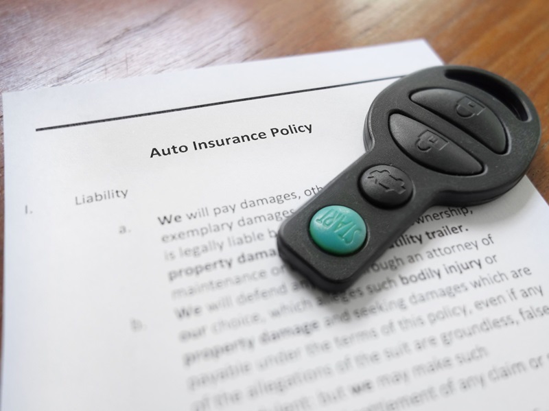 Car key and auto insurance policy