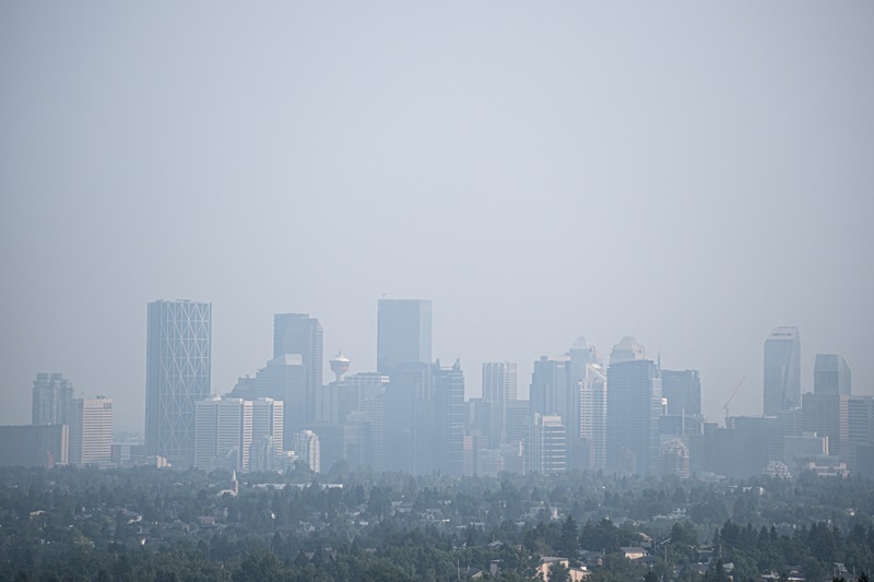 Downtown Calgary Alberta City Skyline under smokeDowntown city street covered with smoke from forest fires