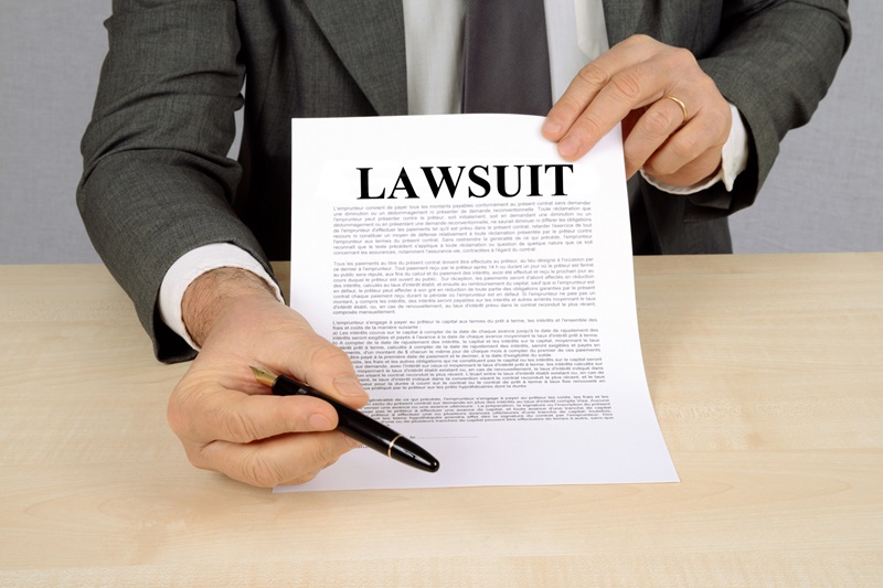 Lawyer giving someone notice of a lawsuit and asking them to sign the document