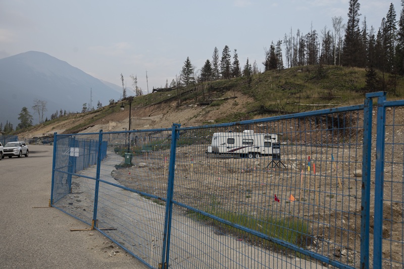 An empty lot one year after the 2024 Jasper wildfire.