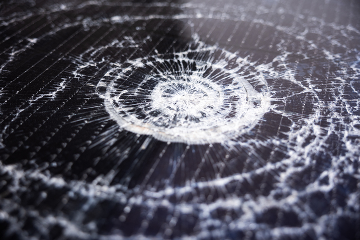 Damaged solar panel from hail alternate text for this image