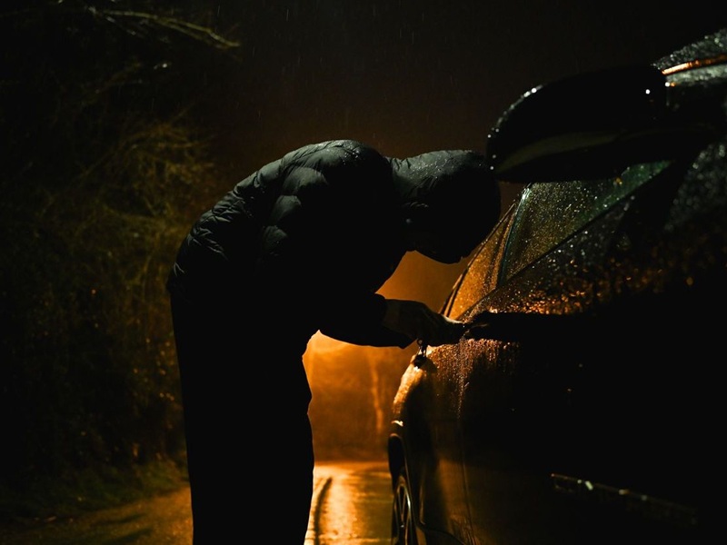 Man trying to break into a car