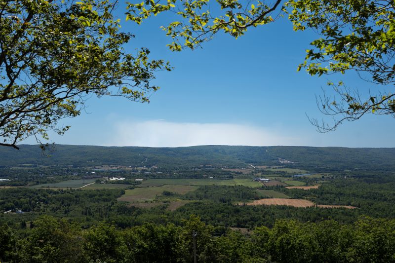 Smoke is seen over the landscape where firefighters are battling the Long Lake wildfire in Nova Scotia's Annapolis County, outside the community of West Dalhousie, N.S., on Tuesday, Aug. 19, 2025. THE CANADIAN PRESS/Darren Calabrese