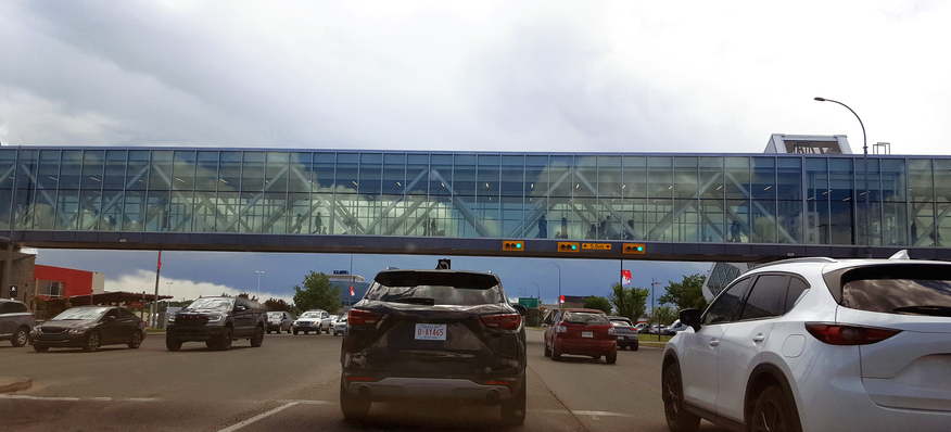 Calgary Alberta Overpass. McLeod Trail S.W. Traffic and people going about their day.
