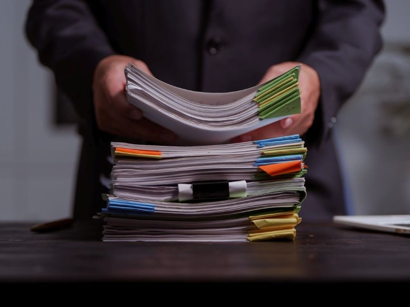 Pile of lawsuits on a desk