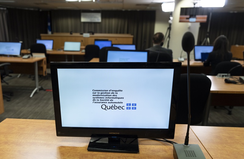 A sign on a computer monitor verifies the proceedings at the Gallant Commission , which is investigating cost overruns of a tech project for Quebec's auto insurance board. The Canadian Press/Christinne Muschi