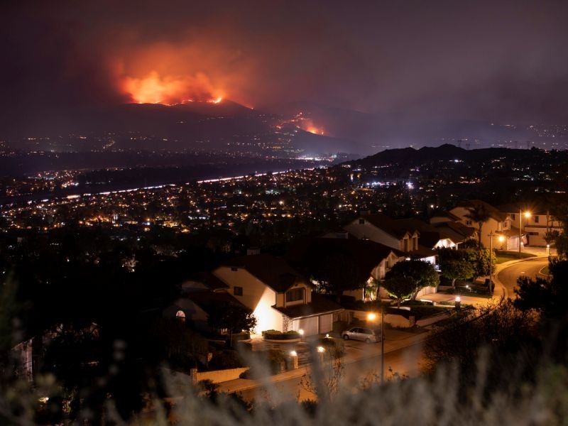 Neighbourhood with fire in the nearby mountains
