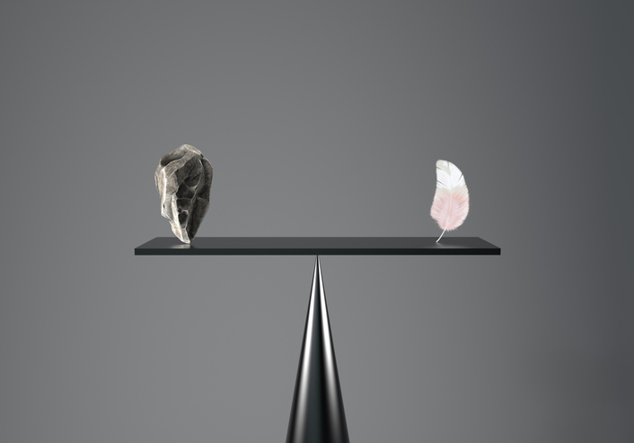 Digital generated image of the stone balances with the feather on a grey background