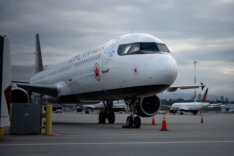 An Air Canada plane sits at Vancouver International Airport in Richmond, B.C., on Sunday, Aug. 17, 2025. Air Canada made the call to halt a return to operation as flight attendants continue to strike. THE CANADIAN PRESS/Ethan Cairns