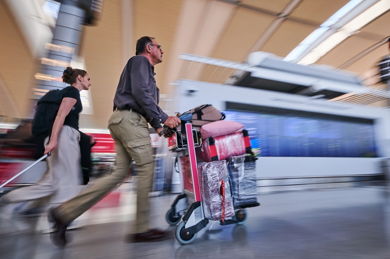Travellers rush towards the Air Canada departure gates as flight attendants strike at Pearson International Airport in Toronto on Saturday, Aug. 16, 2025. THE CANADIAN PRESS/Sammy Kogan