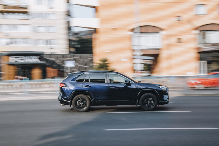 Blue Toyota RAV 4 car moving on the street