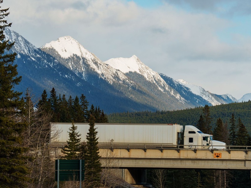 Truck on highway driving through Banff National Park