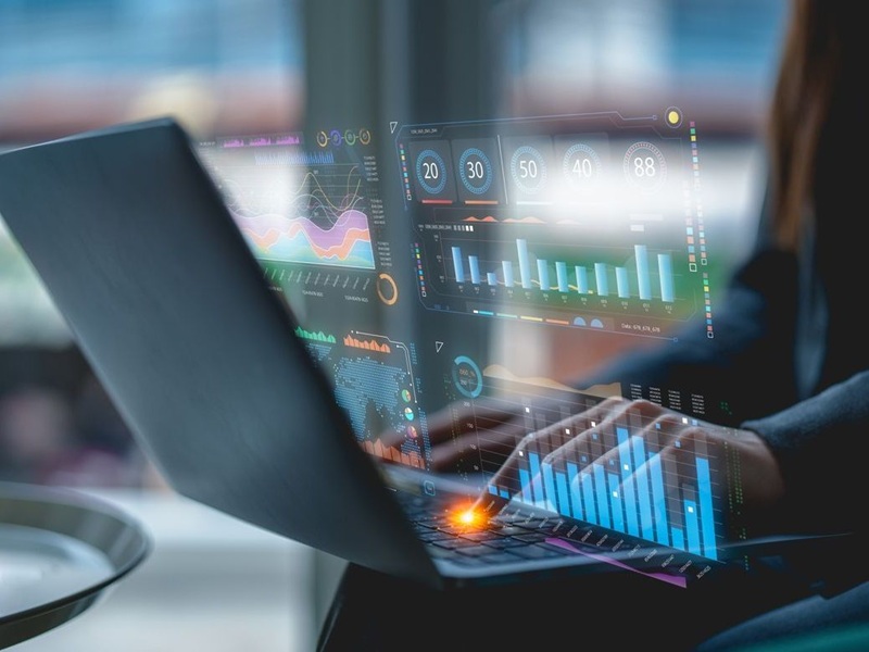 Using a laptop to access an AI-powered business analytics dashboard