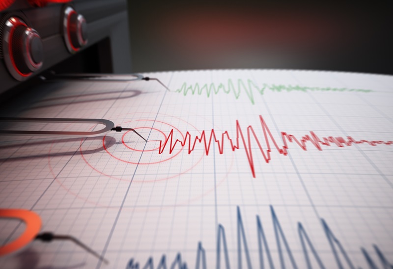 Seismograph printing seismic activity records of a severe earthquake.
