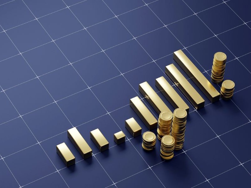 Stacks of gold representing business growth.