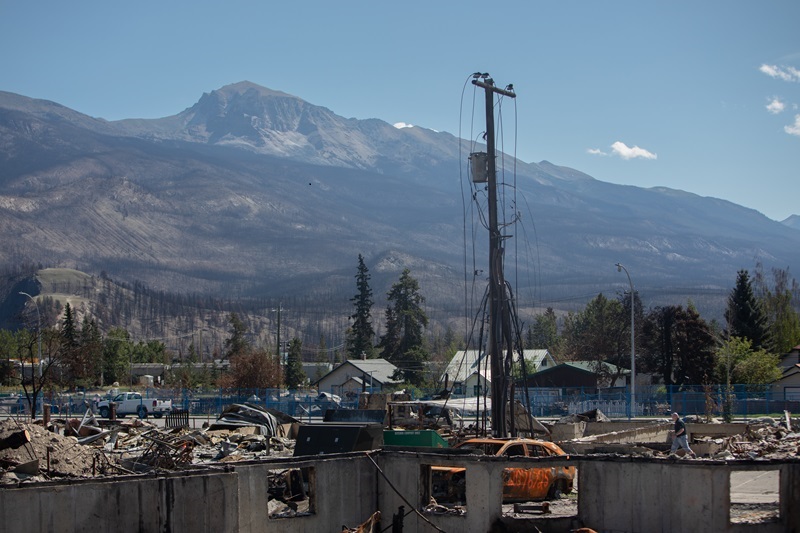 Work continues to assess, repair and rebuild as some residents return to Jasper, Alberta on Monday August 19, 2024. Wildfire caused evacuations and widespread damage in the National Park and Jasper townsite. THE CANADIAN PRESS/Amber Bracken