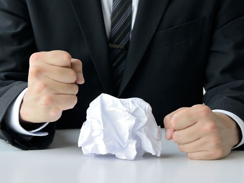 Frustrated business man with solid fist